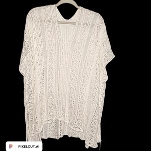 Crocheted egg shell colored swim cover  One Size tassels on the sides.